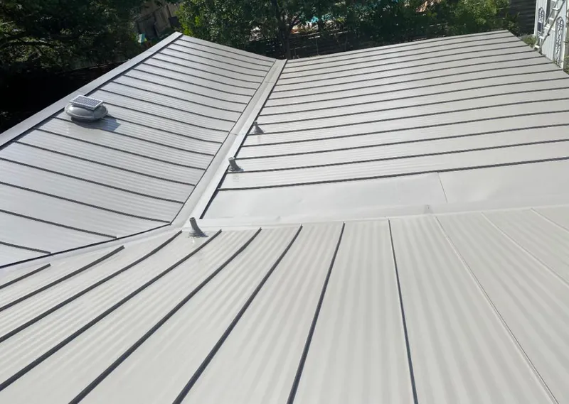 Solar attic fan installed on a metal roof for Roof Ventilation in Madras